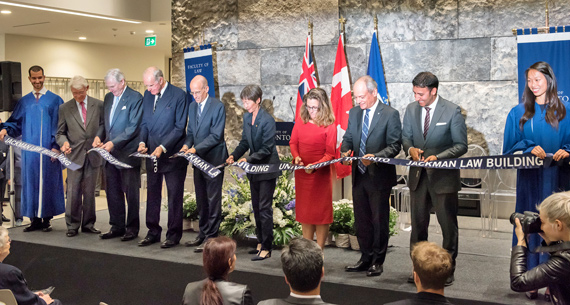 The official cut: (L) Lucas Hildebrand, student gonfalonier, Campaign Co-Chair Tom Rahilly, Chancellor Michael Wilson, the Hon. Hal Jackman, Dean Ed Iacobucci, Governing Council Chair Shirley Hoy, the Hon. Chrystia Freeland, Minister of International Trade with President Meric Gertler, alumnus and MP Arif Virani and Christina Liao, student gonfalonier.