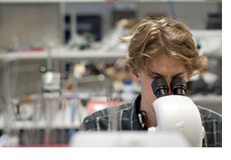 A photo of a student in a lab