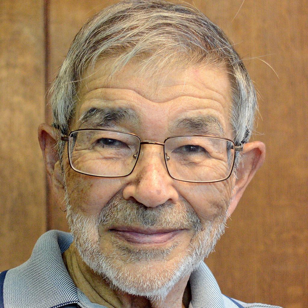 A headshot of Art Chow wearing glasses and smiling 