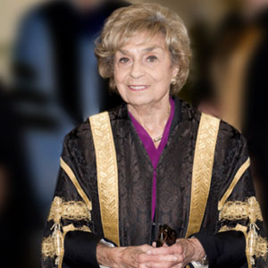 A photo of Rose Wolfe wearing ceremonial U of T Convocation robes 