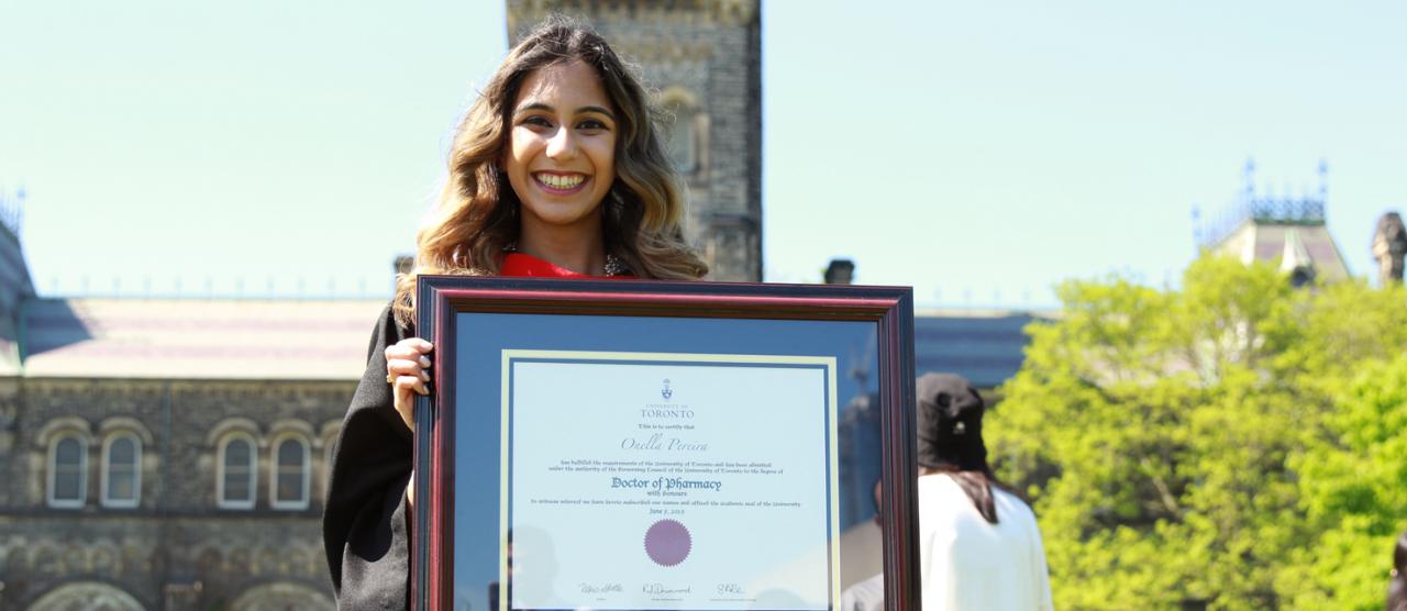 Image of student holding her degree